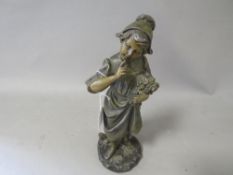 A bronze type figure signed to the base