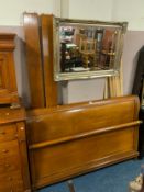 A modern cherrywood double bed frame with side slats and base slats