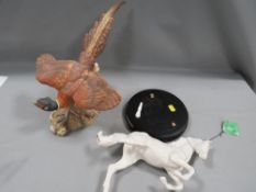 A Beswick matt finish model of a pheasant together with 