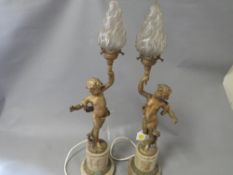 A pair of gilt metal French style table lamps with flame shades A/F