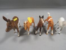 Four Beswick foals and a donkey (5)