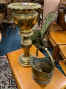 A brass effect jardiniaire and stand together with a coal helmet