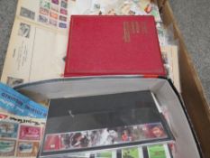 A box of stamp albums and stamps