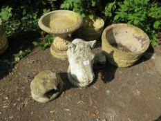 A selection of concrete garden items to include two planters, bird bath and three statues - two
