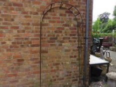 A wrought iron garden arch