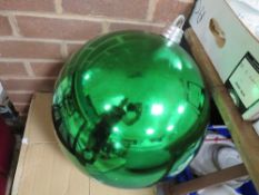 An oversized Christmas bauble