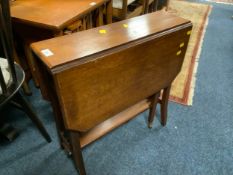 An Edwardian mahogany Sutherland table and two modern Chinese woolen rugs