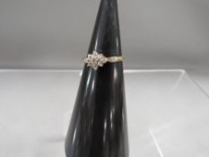 A hallmarked 9 carat gold diamond cluster ring approx. weight 1.6g