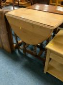 An oak barleytwist drop leaf table
