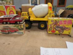 A LARGE TONKA TURBO DIESEL CONCRETE MIXER, a 1960s Chinese made tin plate bus together with a