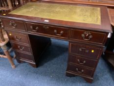 A reproduction mahogany twin pedestal desk with green tooled leather top W 110 cm