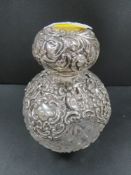 A large silver mounted cut glass scent bottle