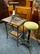 A vintage bamboo table together with a lightweight cast stool and stool base