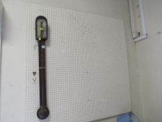 A vintage stick style barometer