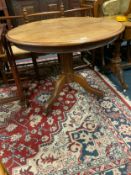 An antique oak circular pedestal table with snap lock mechanism but fixed top Dia. 94 cm