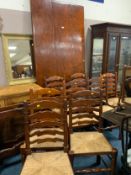 A large quality refractory Spanish style table together with eight ladderback wicker seat chairs