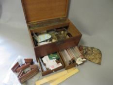 An antique oak box and contents