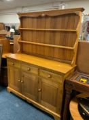 A honey pine kitchen dresser W 134 cm