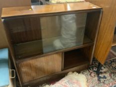 A vintage teak, sliding door bookcase