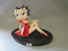 A large sitting red B379 Betty Boop figure with certificate