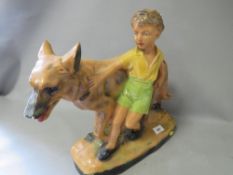 A vintage chalk figure of a boy and his dog A/F