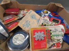 A tray of assorted medals and badges to include carded examples