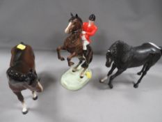 A Beswick rearing huntsman together with two Beswick horses - one A/F (3)
