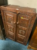 An early antique oak carved two door cupboard AF