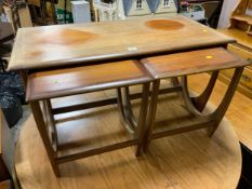 A mid-century teak nest of three tables A/F - possibly G-Plan