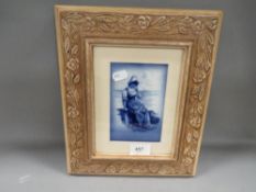 A framed blue/white antique Royal Doulton panel