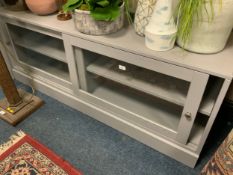 A modern blue sliding door low sideboard