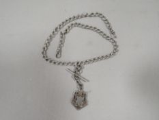 An antique silver gents pocket watch double Albert chain