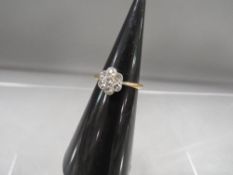 An 18 carat diamond flower ring