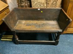 An antique oak dough style bin with open front