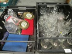 Two trays of assorted glassware to include decanters etc