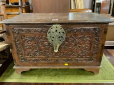 A small carved eastern style box with elaborate twin handles W 69 cm