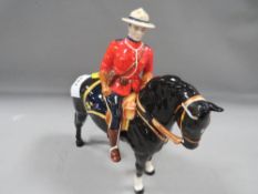 A Beswick Canadian Mountie - small chip to rim of hat