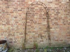 A wrought iron garden arch