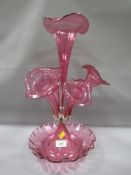 An early 20th century cranberry glass epergne