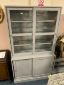 A large modern blue sliding door bookcase