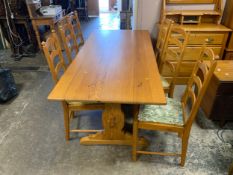 A pine Ercol refectory table and six chairs
