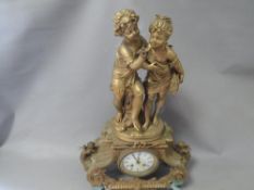 A French style gilt metal figurative mantle clock