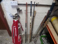 A set of golf clubs and vintage fishing rods