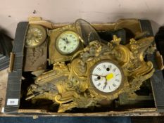 A large collection of assorted clock parts and movements to include three assorted barometers and an