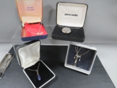 Four boxed silver necklaces