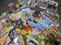 A tray of assorted retro gaming annuals, magazines, books, calendars etc., to include Crash ZX