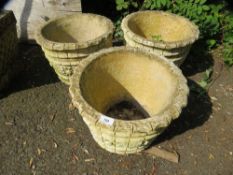 A selection of three matching concrete planters