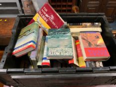 A large black crate of assorted books to include Harry Potter