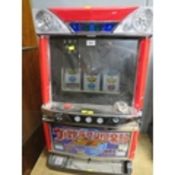 A JAPANESE ELECTRONIC REEL TABLE TOP FRUIT MACHINE, with glazed top front panel, set up for token