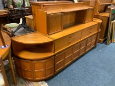 A mid-century teak sideboard together with two matching corner units, possibly by Nathan